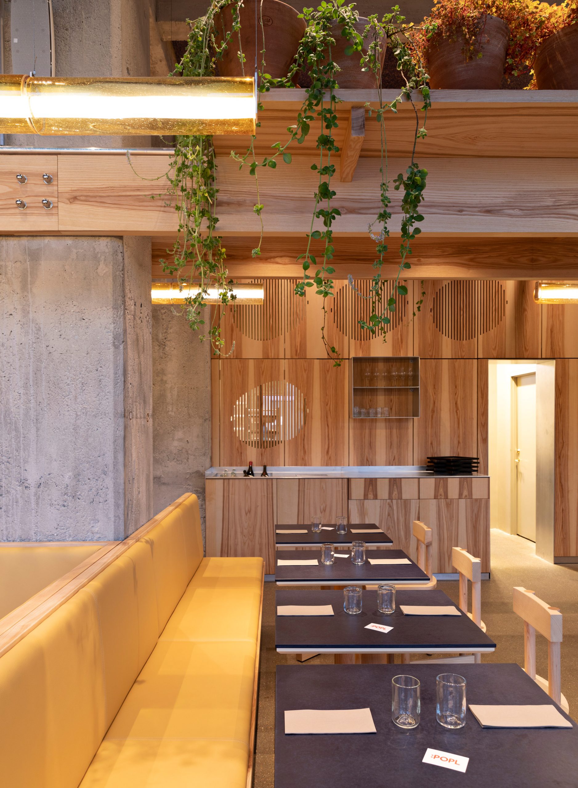 Yellow leather seats in POPL burger restaurant by Spacon & X and e15 for Noma