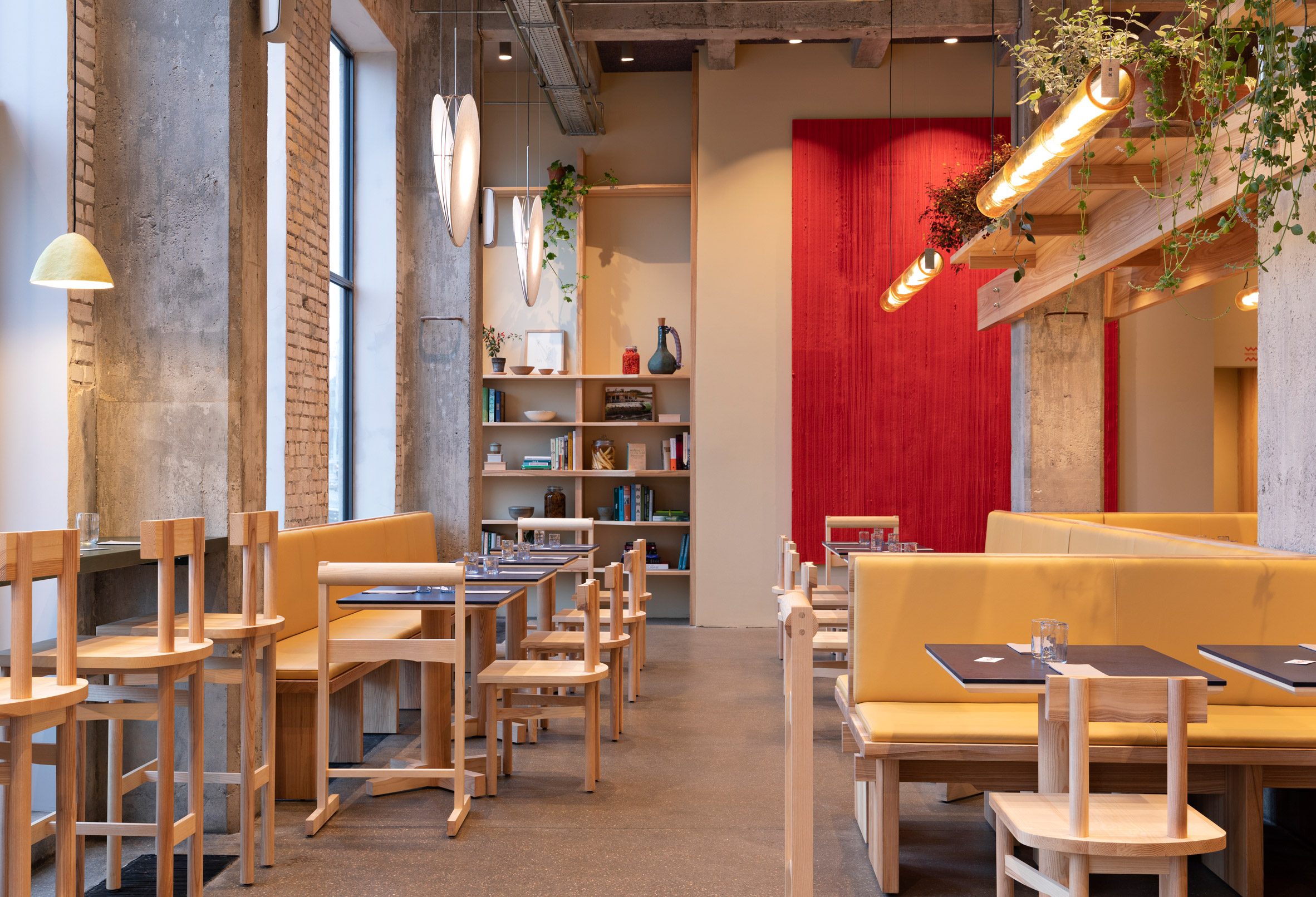 Red and yellow tones in POPL burger restaurant by Spacon & X and e15 for Noma