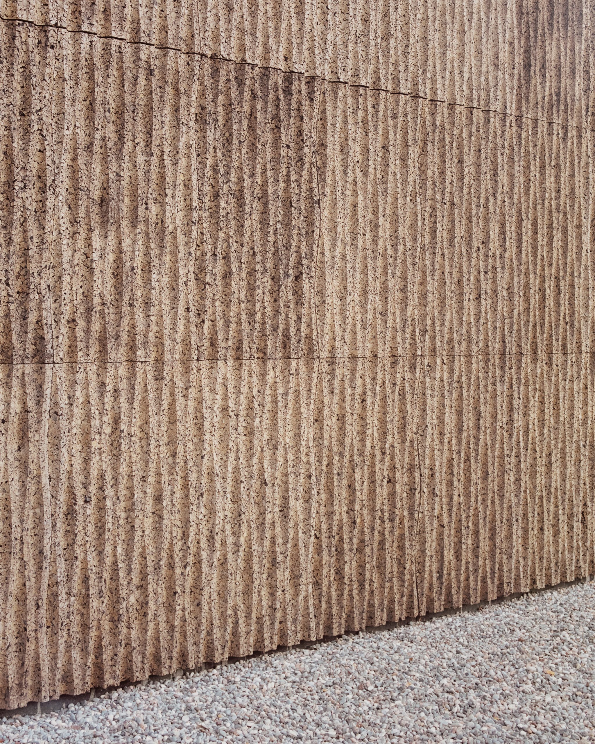 The cork cladding of The House of Wood, Straw and Cork by LCA Architetti