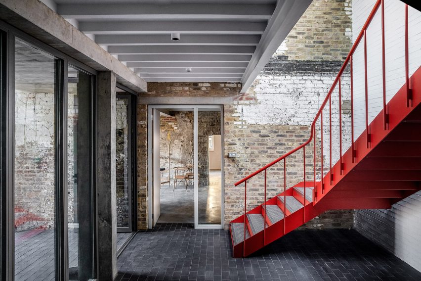 Red staircase at Yorkton Workshops by Pearson Lloyd and Cassion Castle Architects