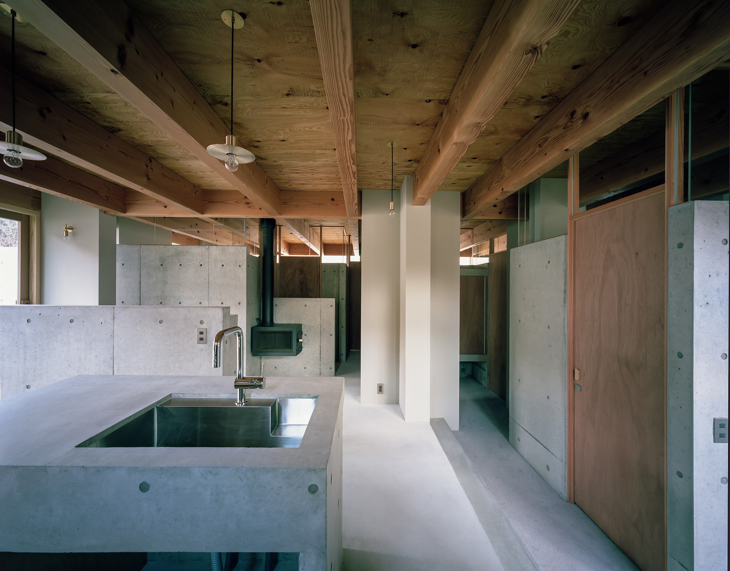 The concrete kitchen and dining room by FujiwaraMuro Architects