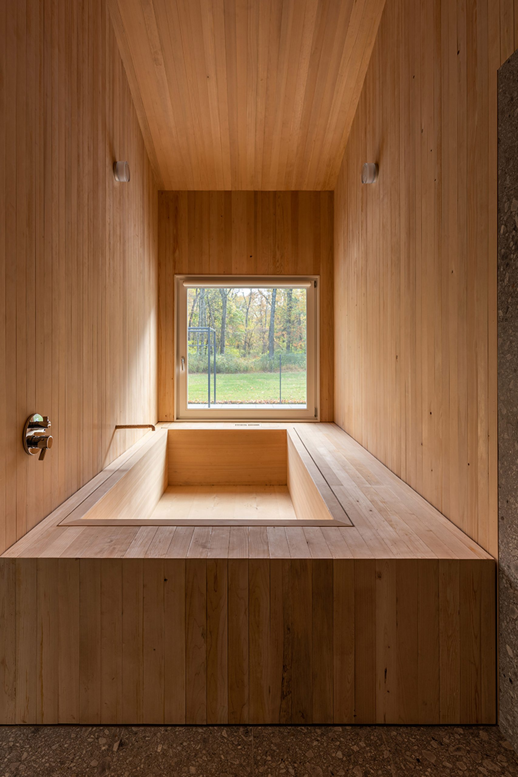 Wooden Japanese sunken bath with a view