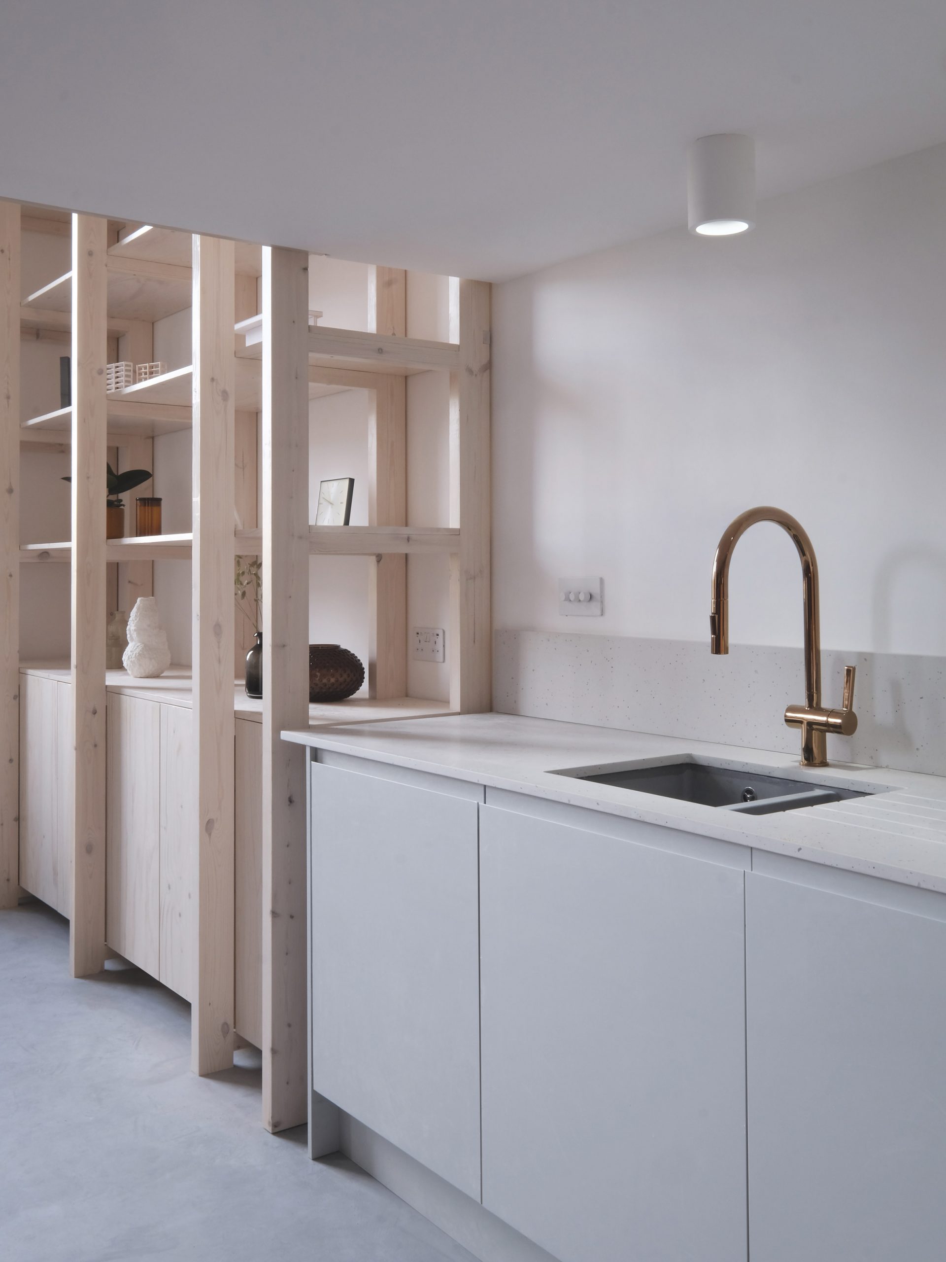 Kitchen and wooden shelving unit from Bow Quarter Apartment interior