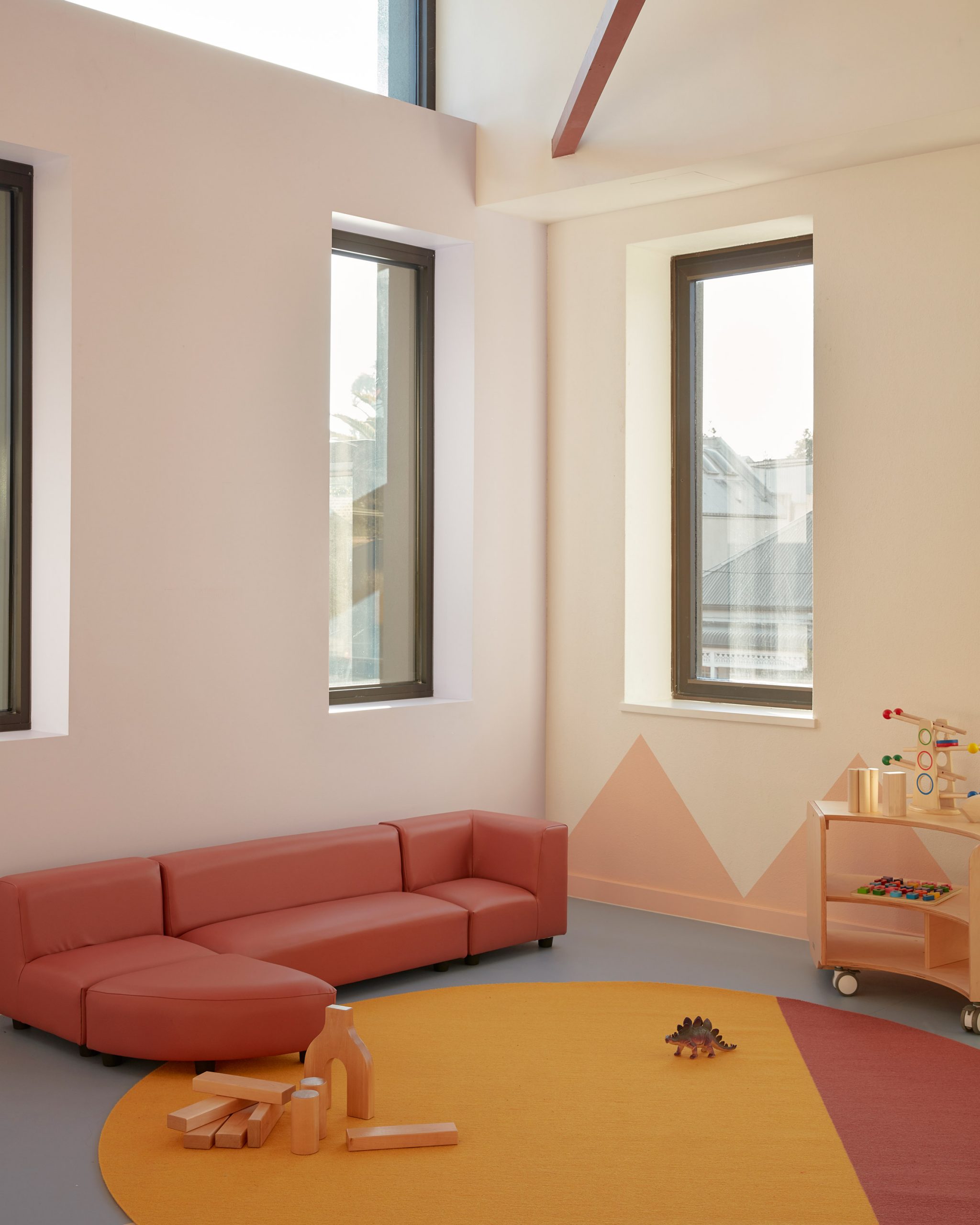 Pink sofa in Brighton Early Learning Centre by Danielle Brustman