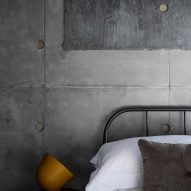 A bedroom of Concrete House by RAW Architecture Workshop in East Sussex
