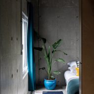 A bedroom of Concrete House by RAW Architecture Workshop in East Sussex