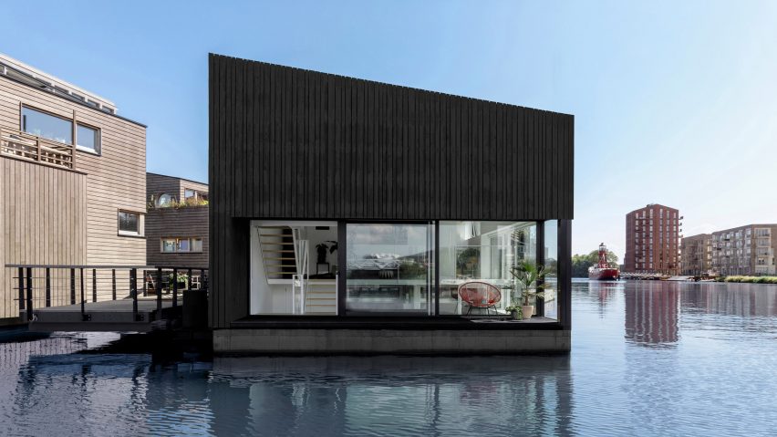 The stained-wood exterior of the floating house by i29