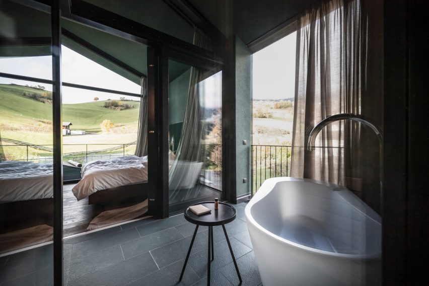 A bathroom and sauna in the Floris hotel extension by NOA