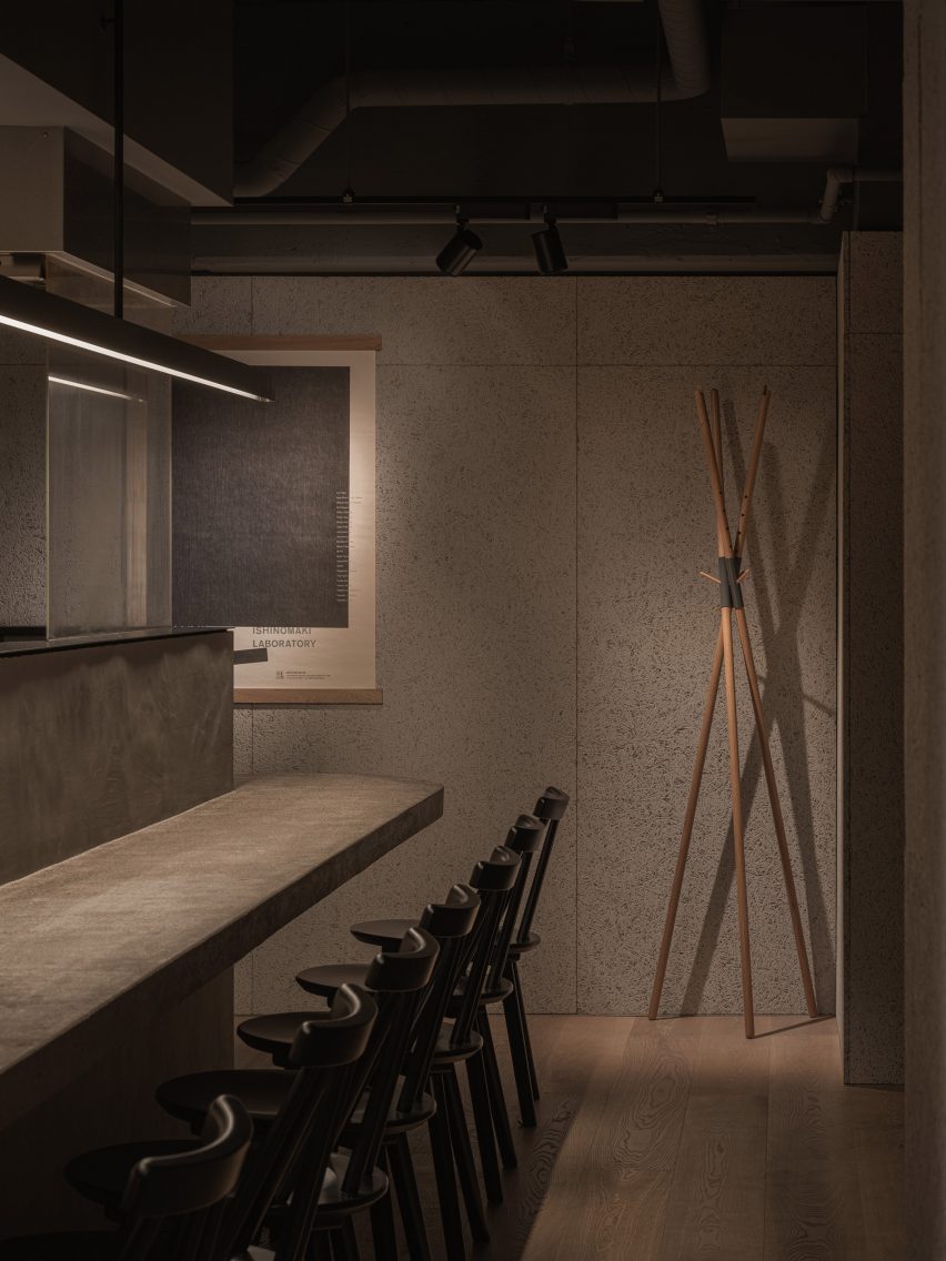 Concrete counter and wood wool cement board walls in Grillno restaurant interior
