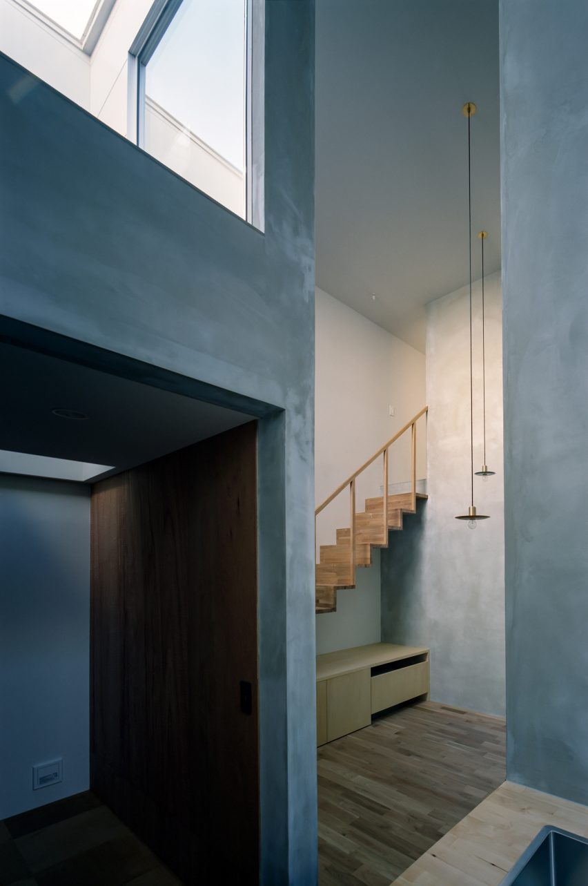 Cement covered walls in house by FujiwaraMuro Architects