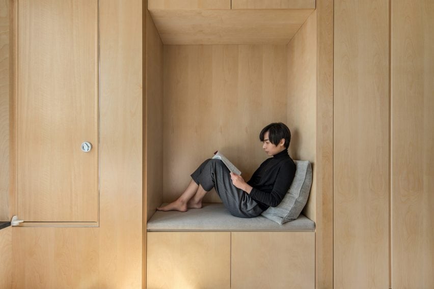 A reading nook inside a LIFE micro-apartment by Ian Lee