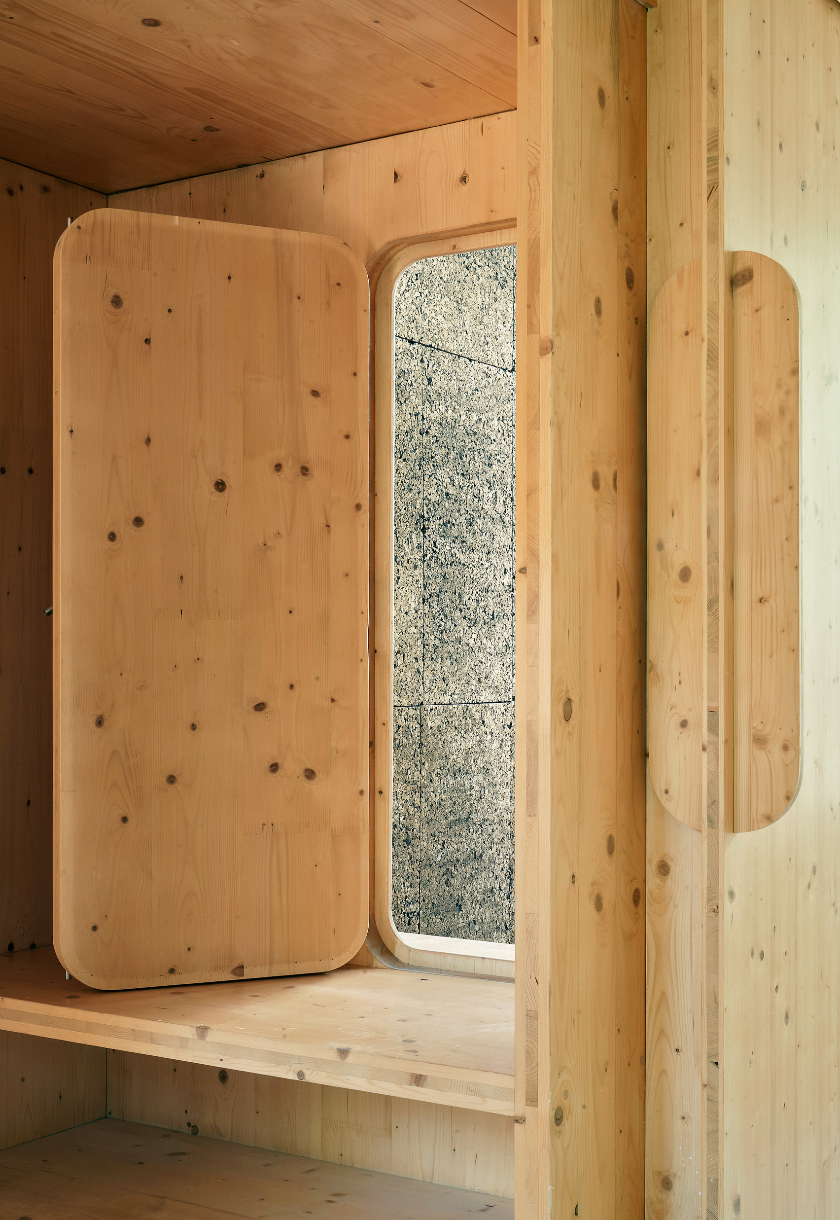 cross laminated timber window openings are rounded framing the exterior 