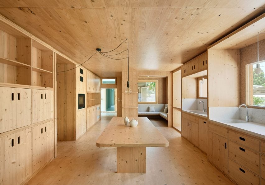 cross laminated timber is used in the multi use kitchen diner space, MAS JEC by Aixopluc