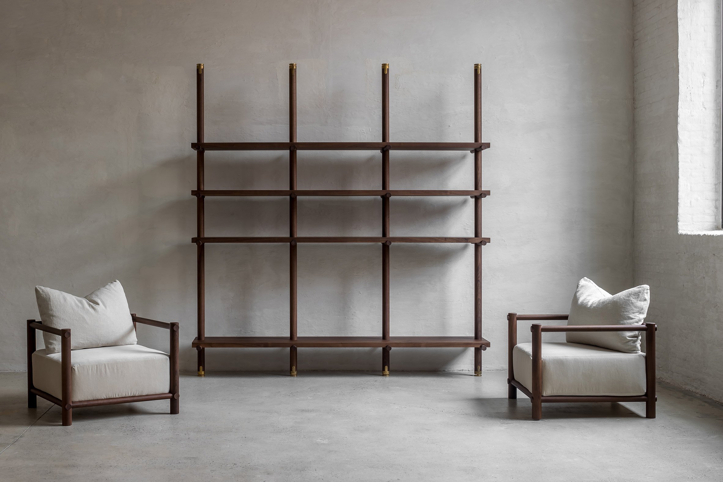 Walnut library and armchairs Nomad furniture by Nathalie Deboel