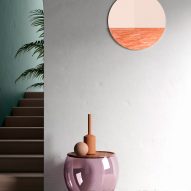 Orizon mirror by Ocrum Studio in coral pink rendered in an interior setting