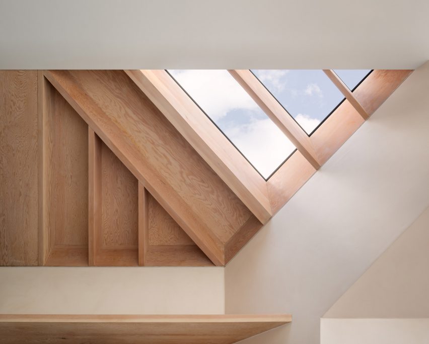 An exposed timber roof in a kitchen by Proctor & Shaw
