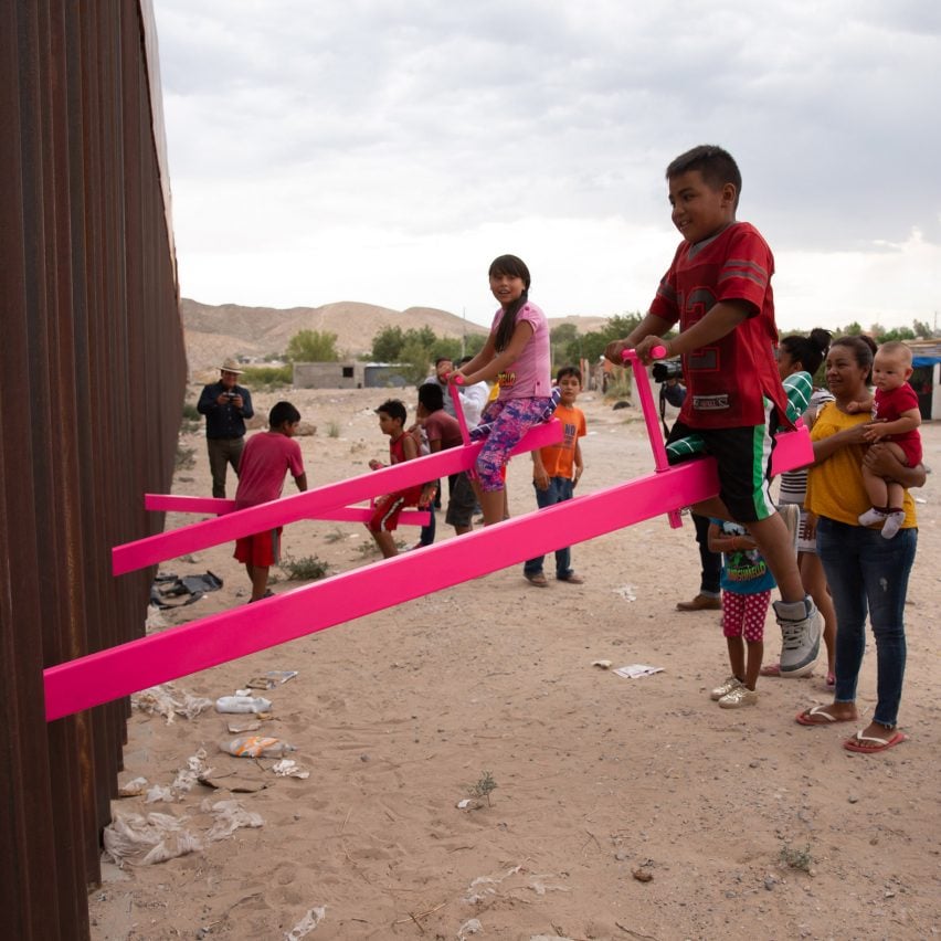 Pink seesaw installation on the US-Mexico border