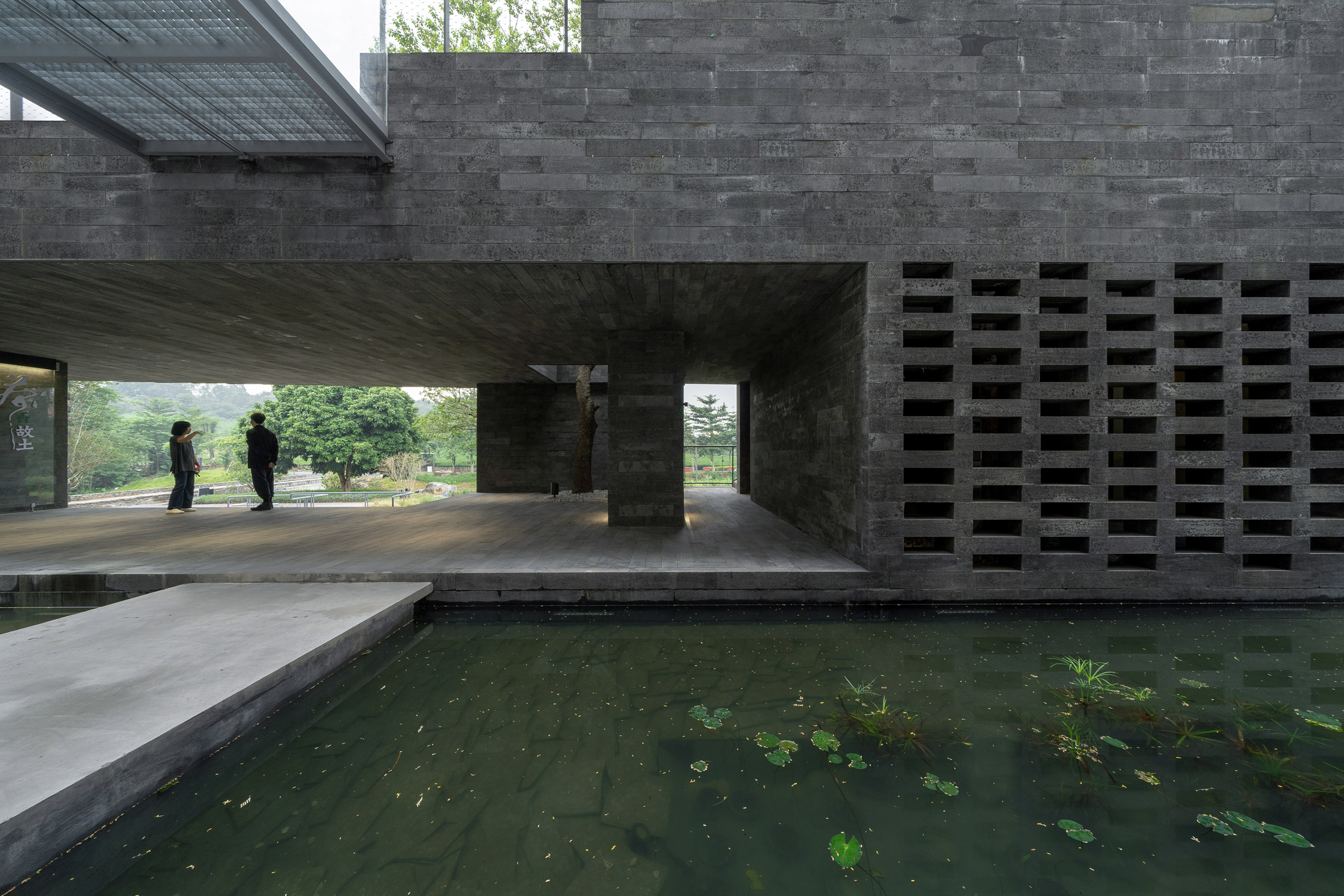 The granite podium of (Re)forming Duichuan Tea Yards centre by O-office Architects