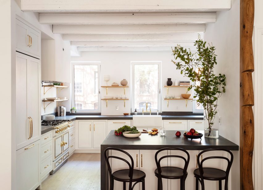 The Sackett Street townhouse's kitchen with exposed beams and hardware fixtures