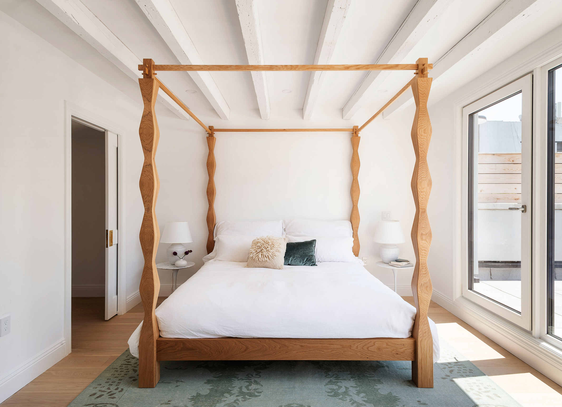 The Sackett Street townhouse's main bedroom's hand-crafted bed