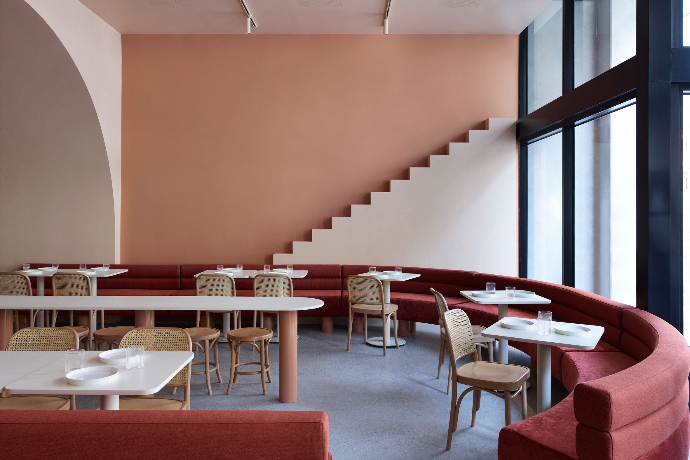 curved banquette seating at The Budapest Cafe by Biasol