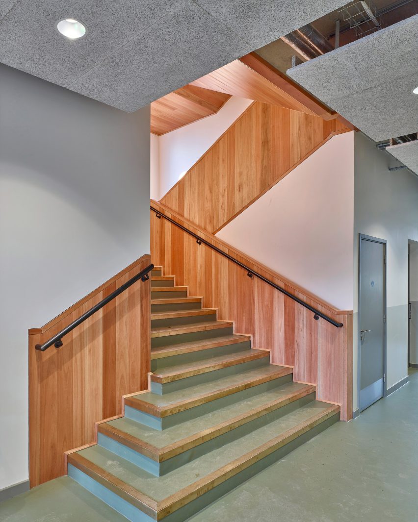 Timber lined stairwell with metal treads