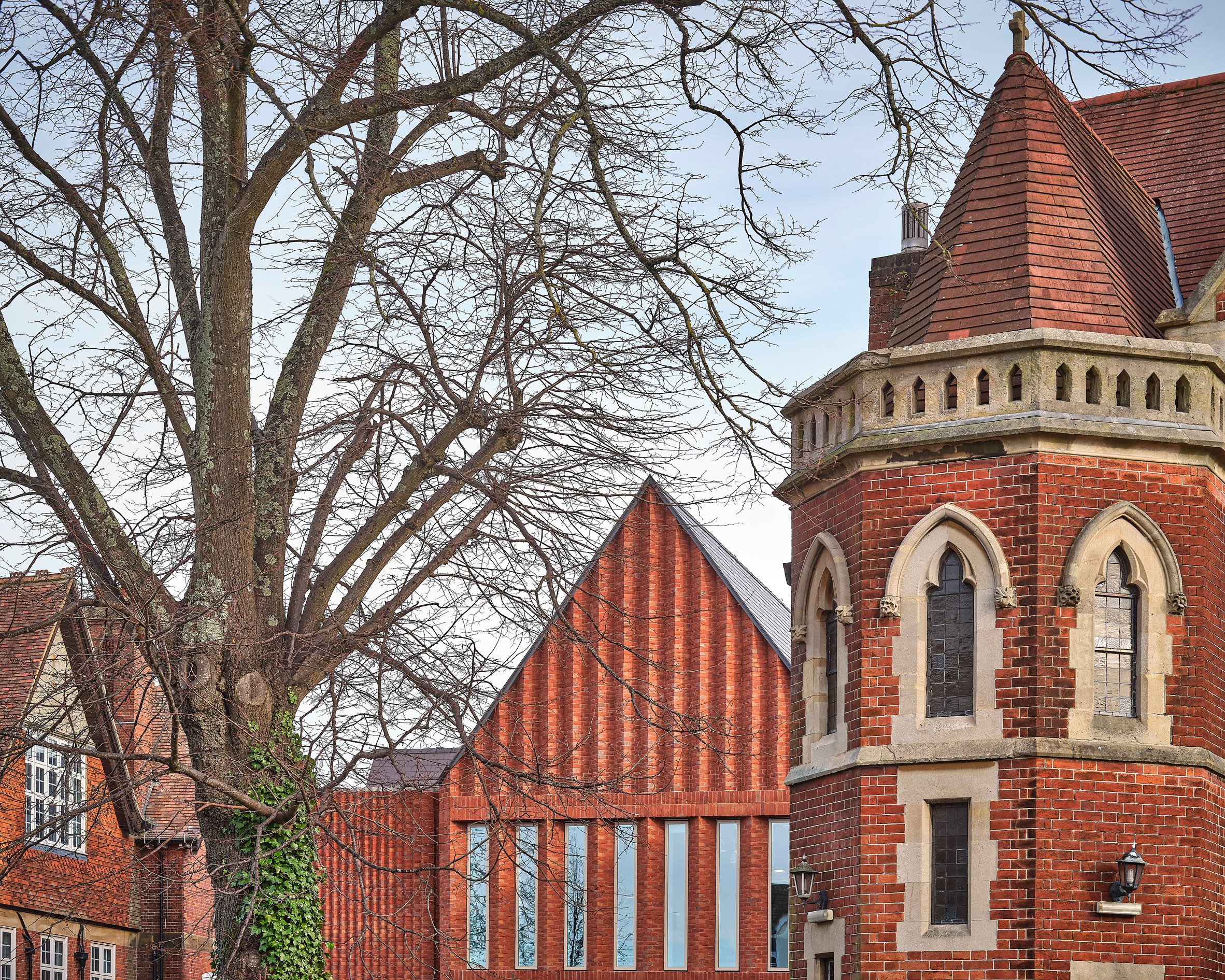 Red brick unifies the new building by Bell Phillips Architects
