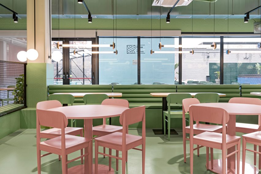 The dining area has green walls and floors