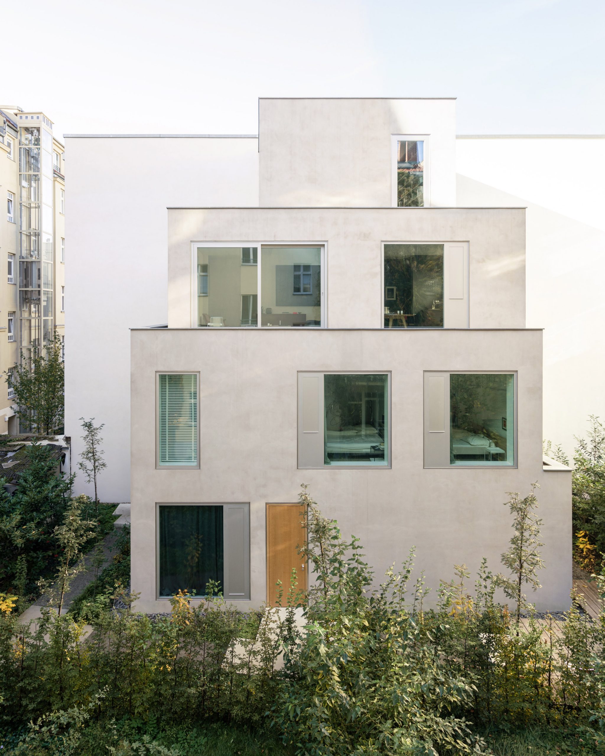 The grey stacked home is located in a Berlin courtyard by Batek Architekten