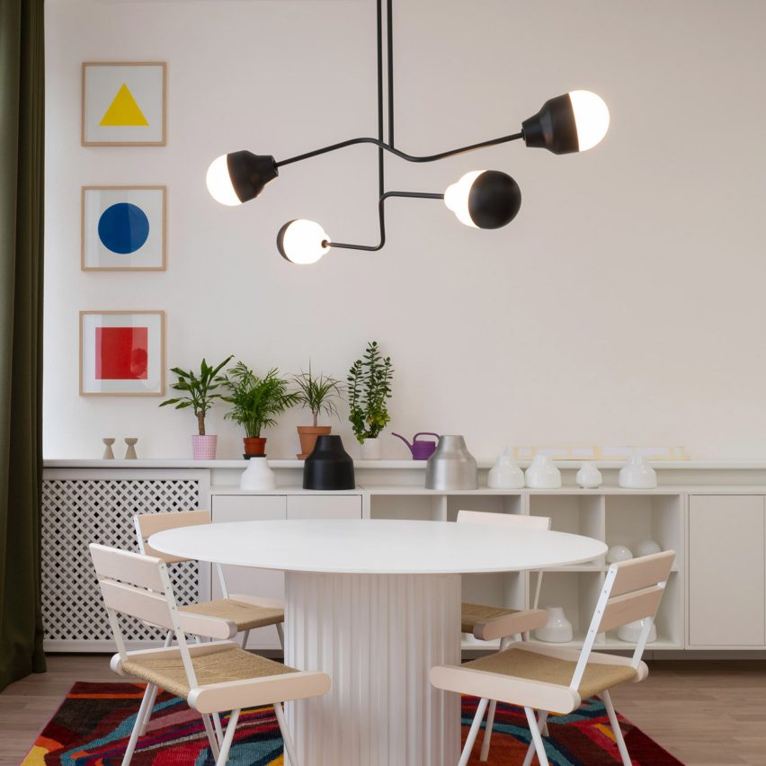 A room with a chandelier by Estonian studio Saarepera & Mae