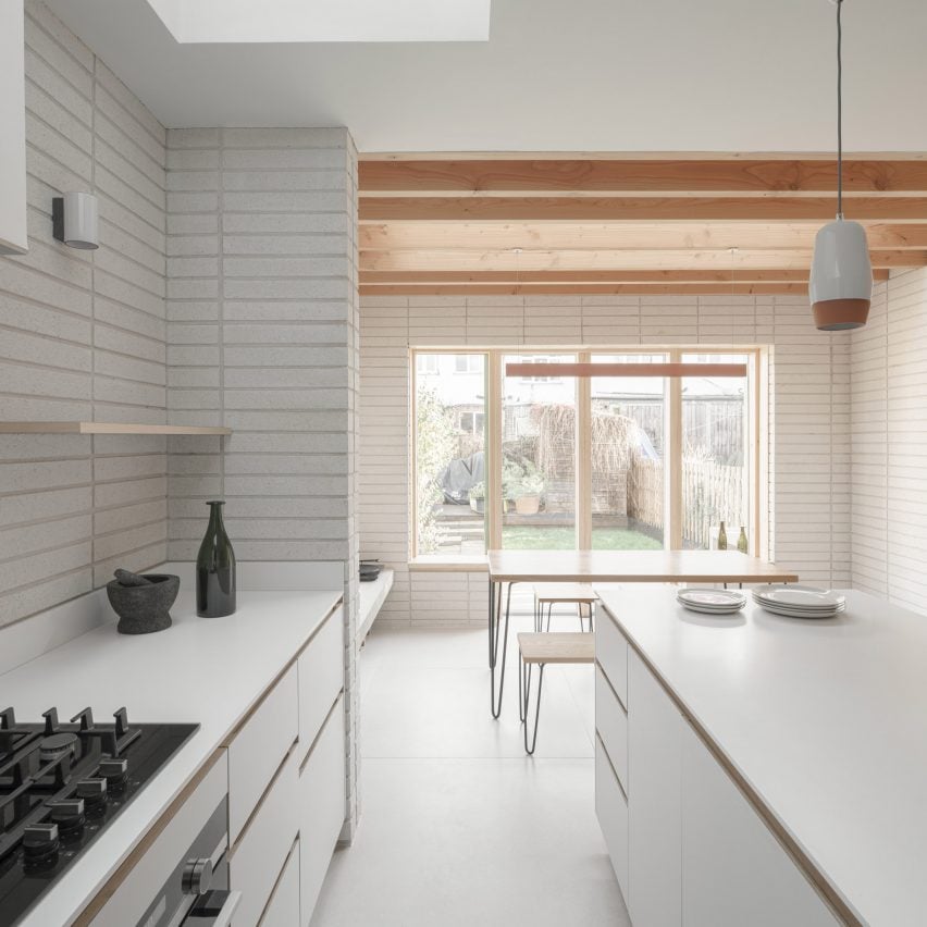 A white kitchen in a London house extension by DeDraft