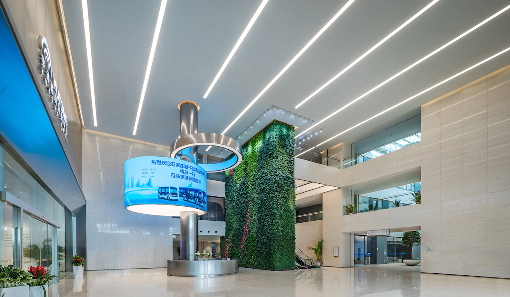 Lobby with green wall in redesigned Zhengzhou Yutong Bus headquarters