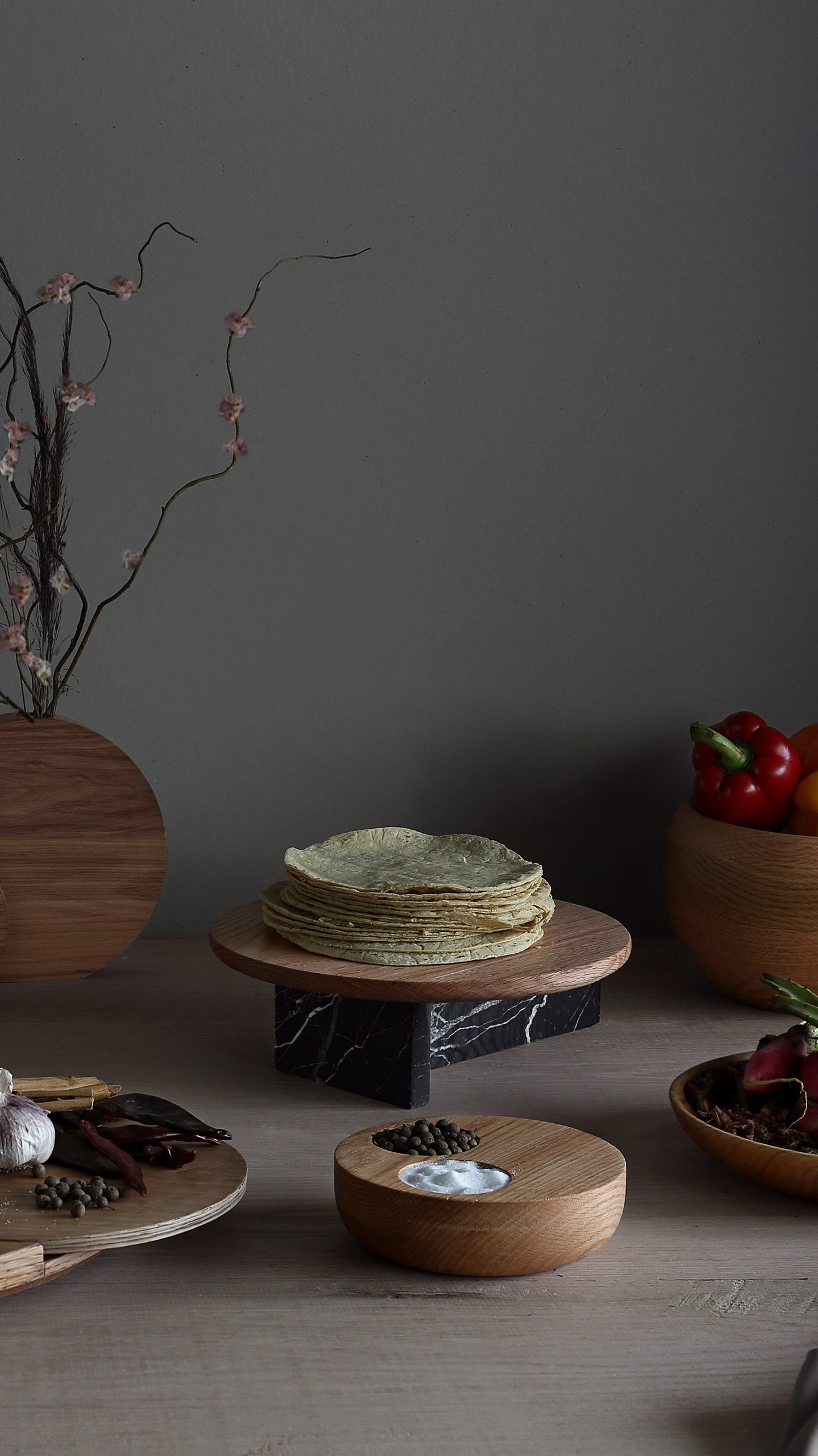 The marble serving plates made by Escalona's students contrast with other wooden objects