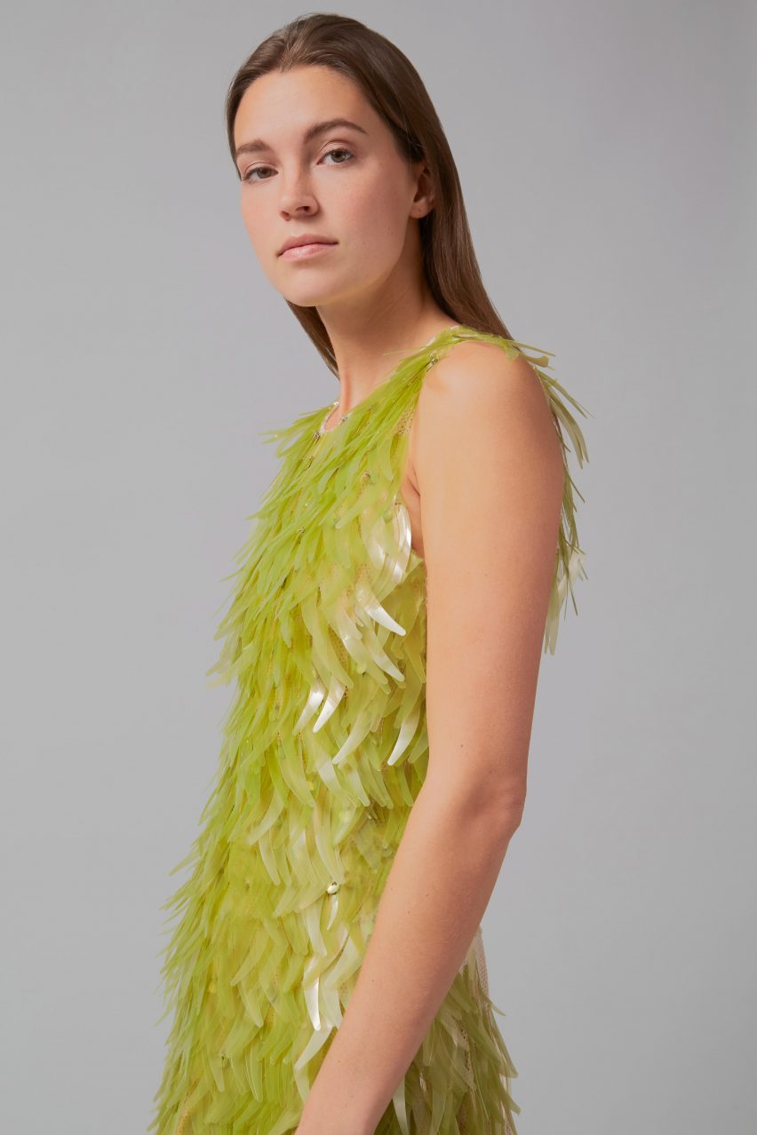 Side profile of algae sequin dress by Phillip Lim as part of One X One project