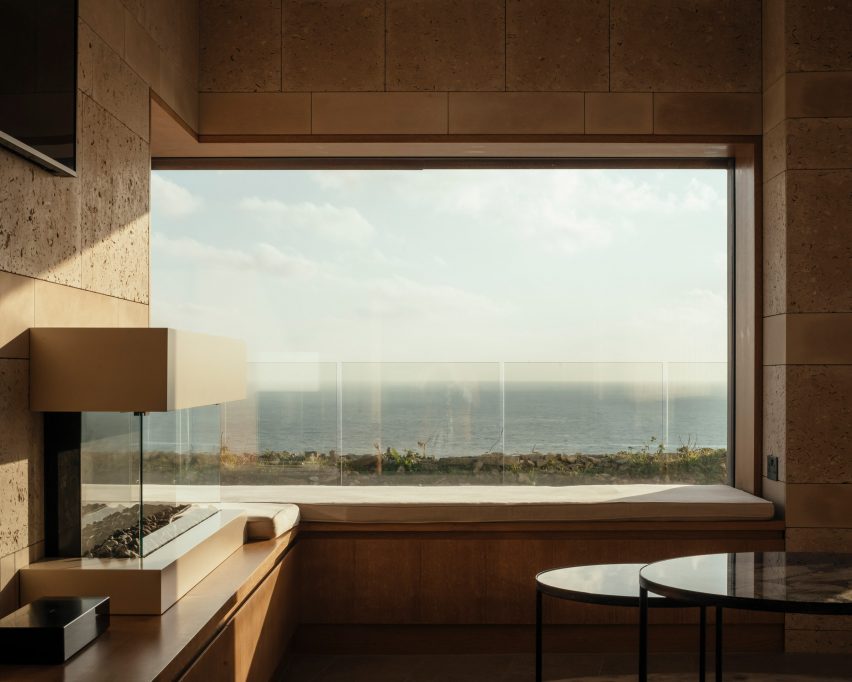 Wood and stone frame the views by Morrow + Lorraine