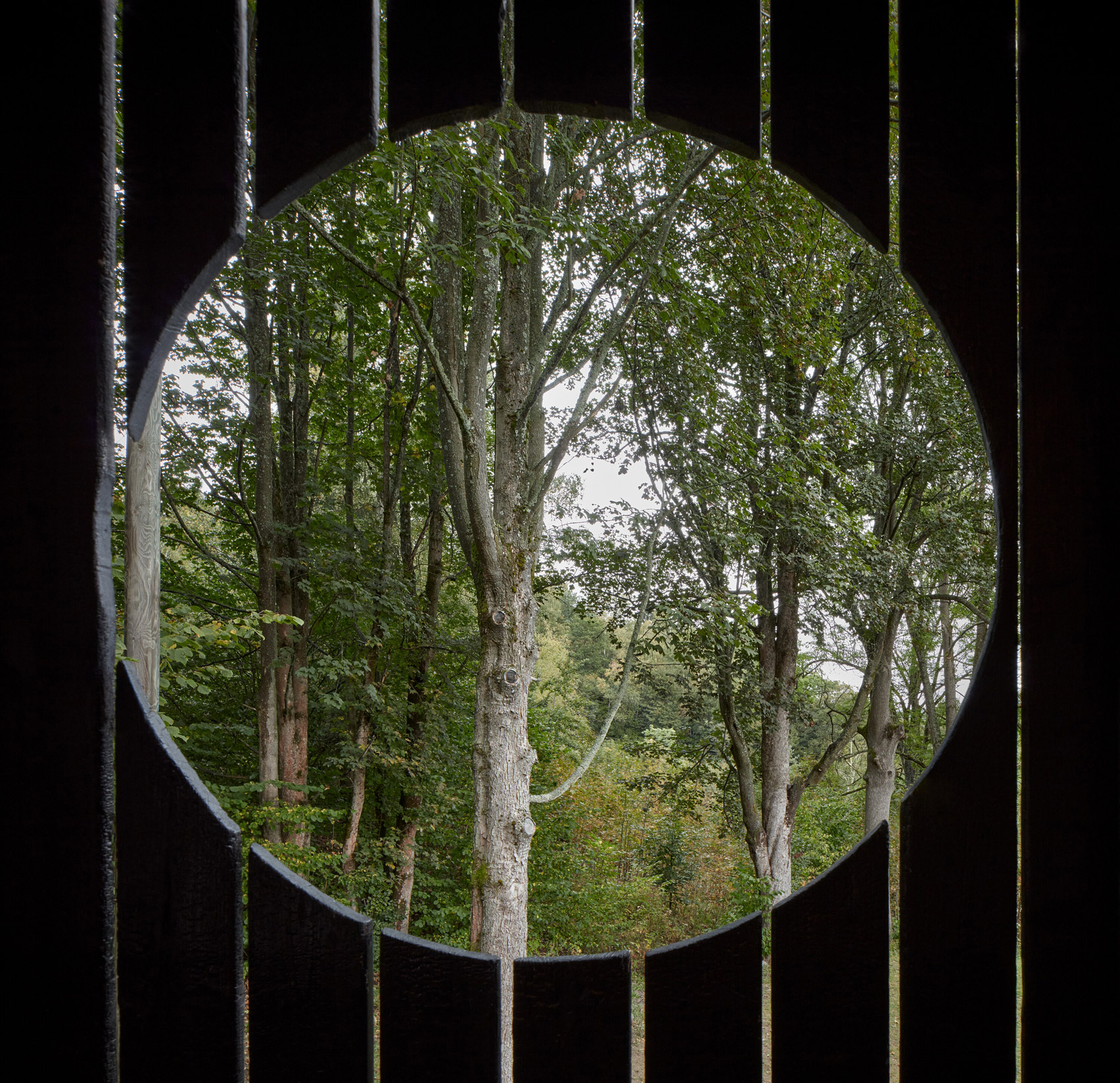 Circular window in wooden house