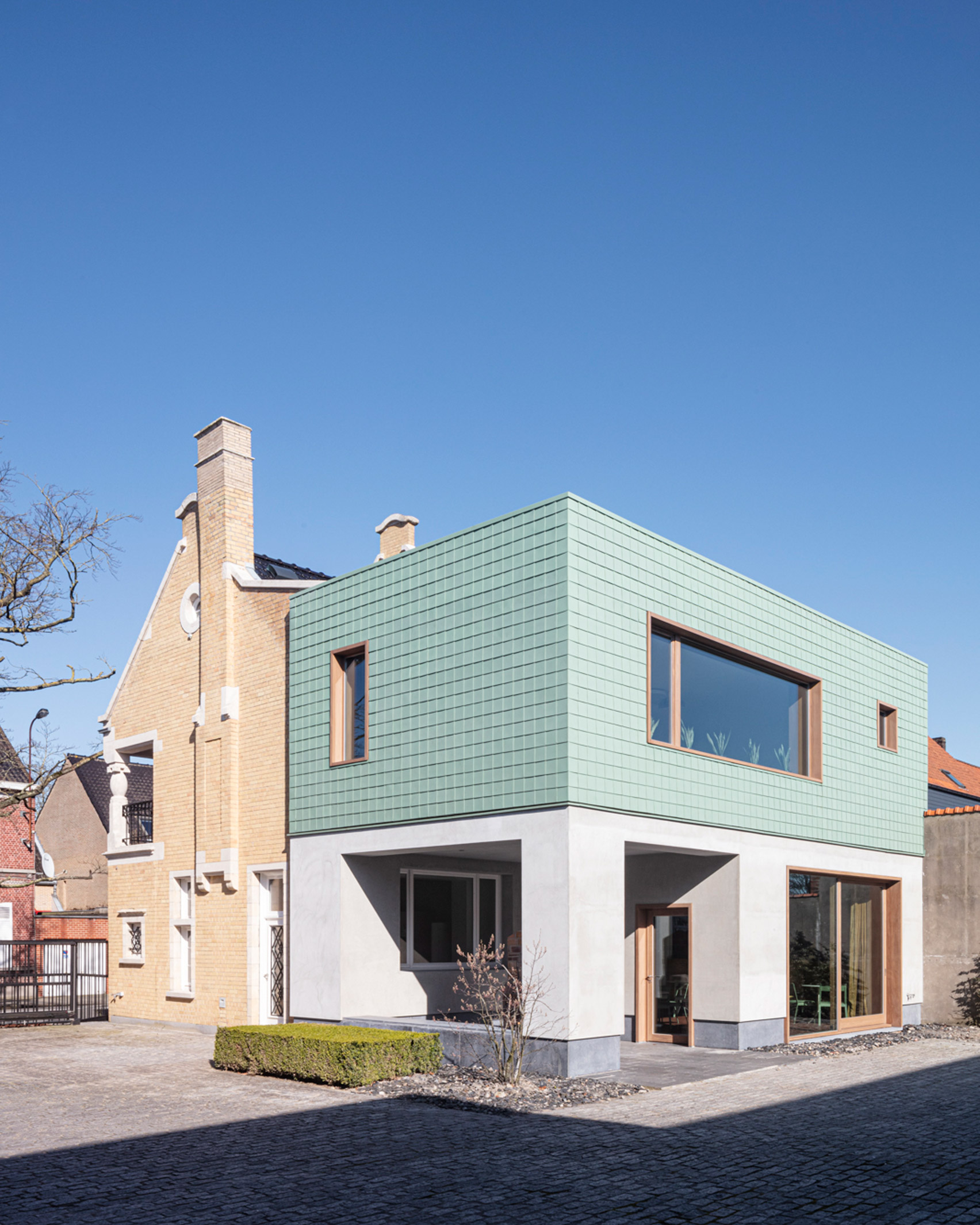 Grey plaster and copper cladding provides a contrast