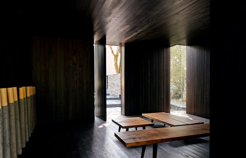 A dark-wood lined meditation room