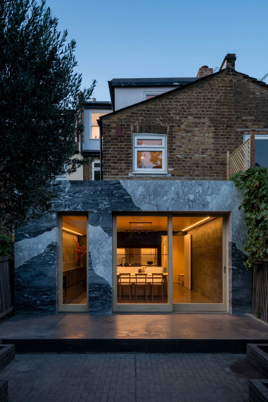 Marble-clad kitchen extension of Hansler Road house at night