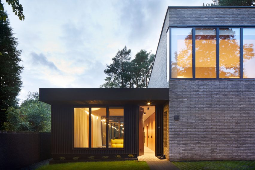 The brick and timber exterior of a house in Glasgow by McGinlay Bell