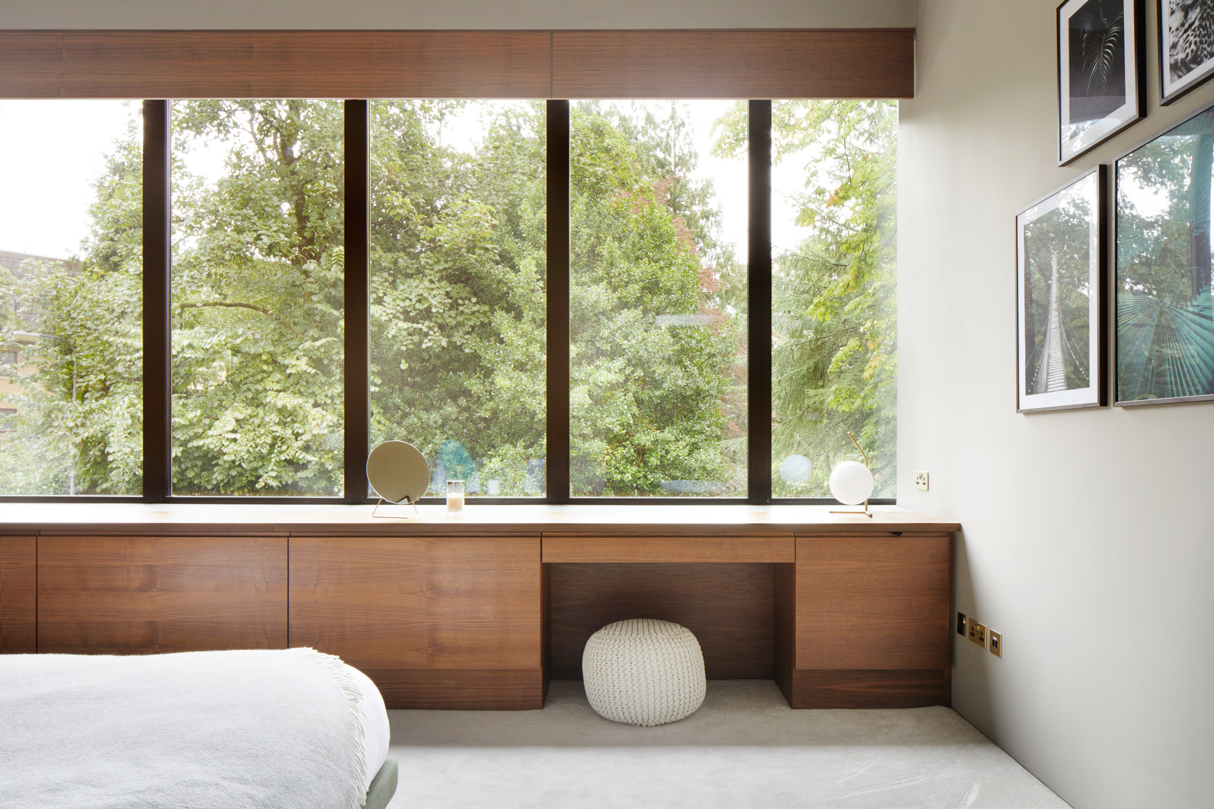 Walnut joinery within a white-walled bedroom in a Scottish house