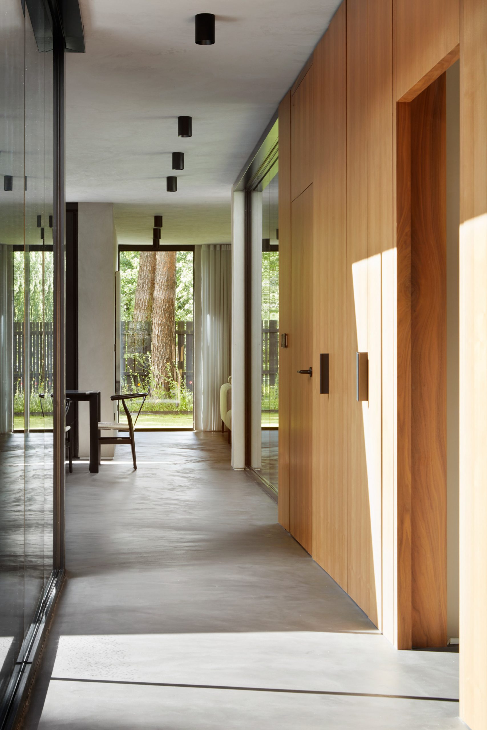 A wood and polished-concrete lined corridor of a Scottish house