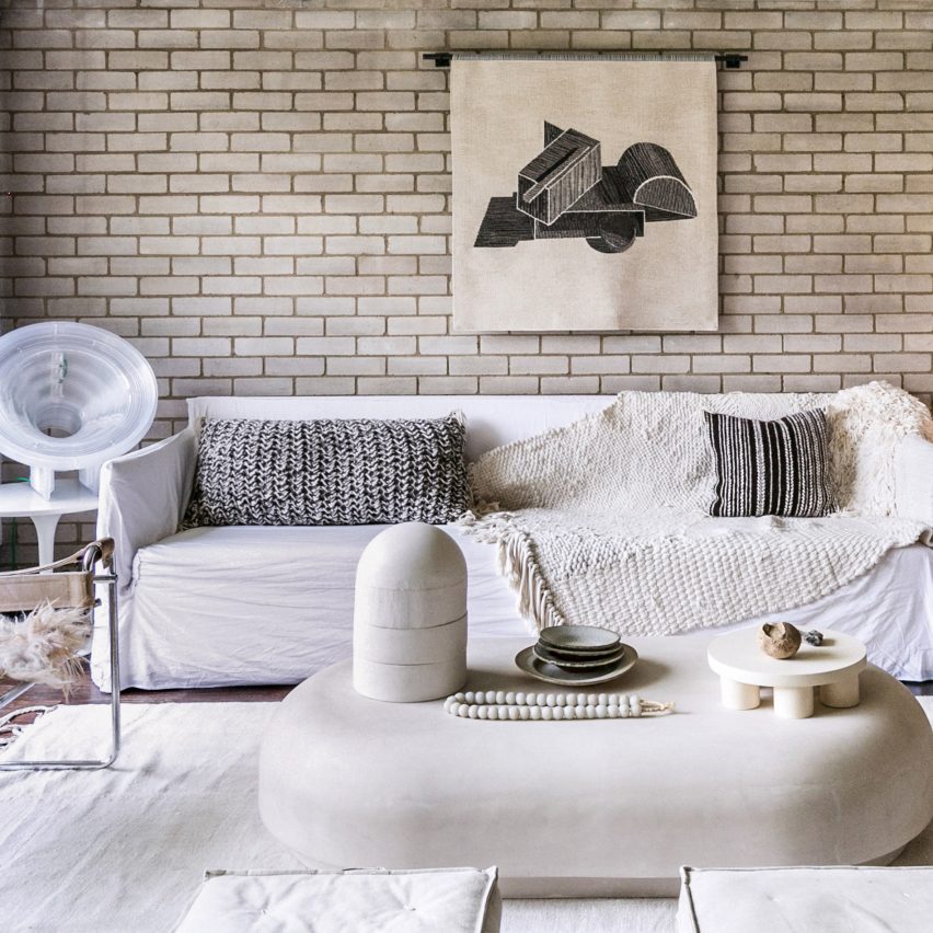 A tactile living room with brick walls