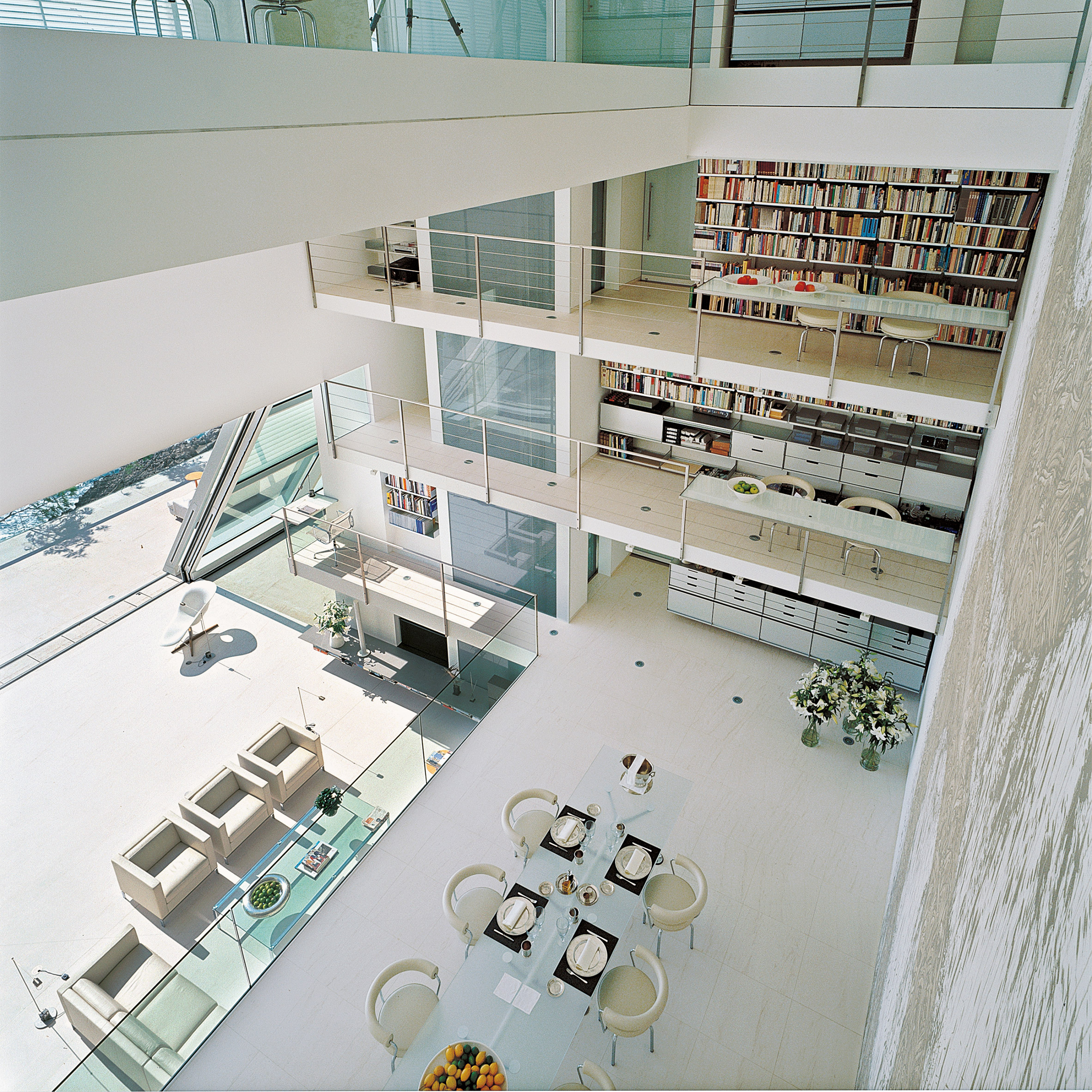 A lofty, white residential dining space