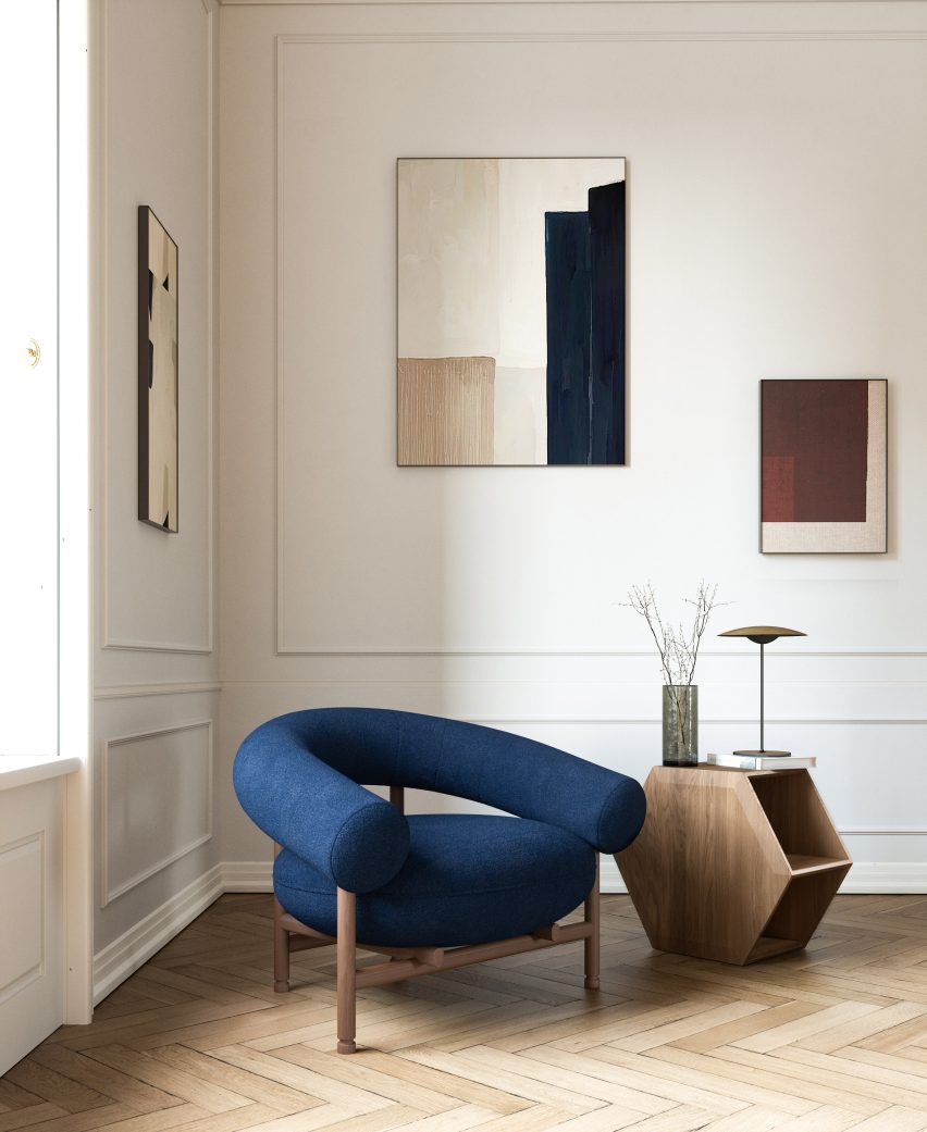 Blue upholstered chair on parquet flooring by David Girelli