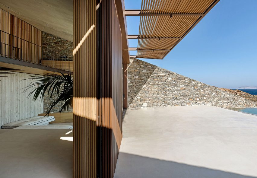 Stone angled wall runs through the entire home