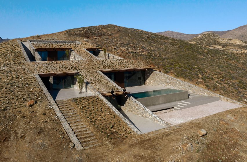 View of different cave-like spaces cut into the hillside by Mold Architects