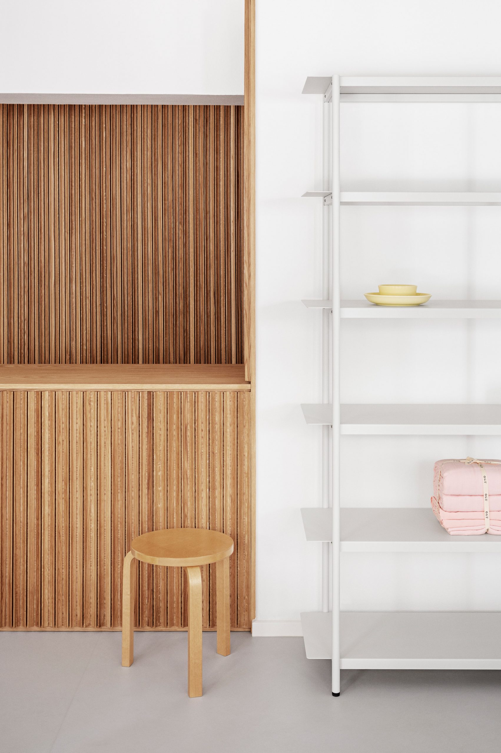 Wooden counter and white shelving in the OCE Copenhagen store interior by Aspekt Office