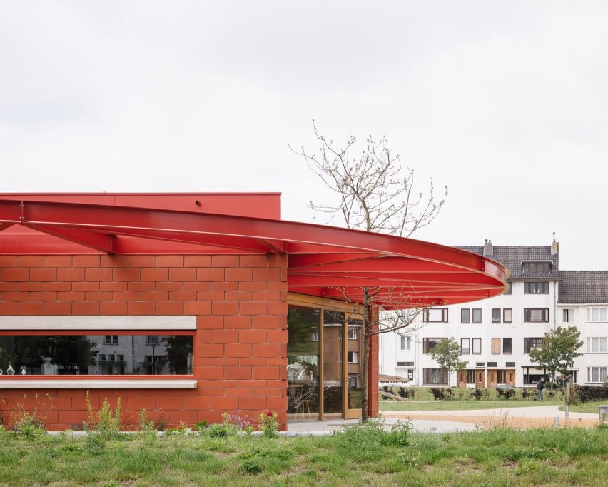 Red brick restaurant with red metal roof