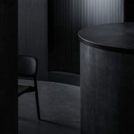 Snøhetta designs Tokyo restaurant with all-black interior and stage-like kitchen